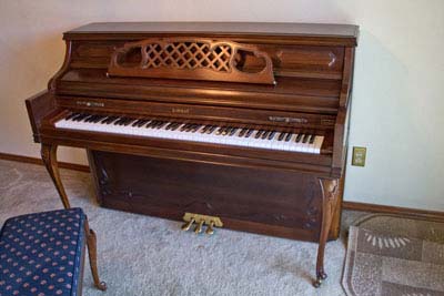 an upright piano opened up for cleaning